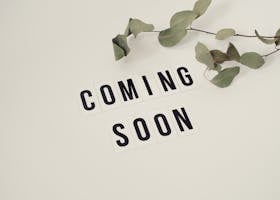 Eucalyptus branch with 'Coming Soon' message on white background for announcements.